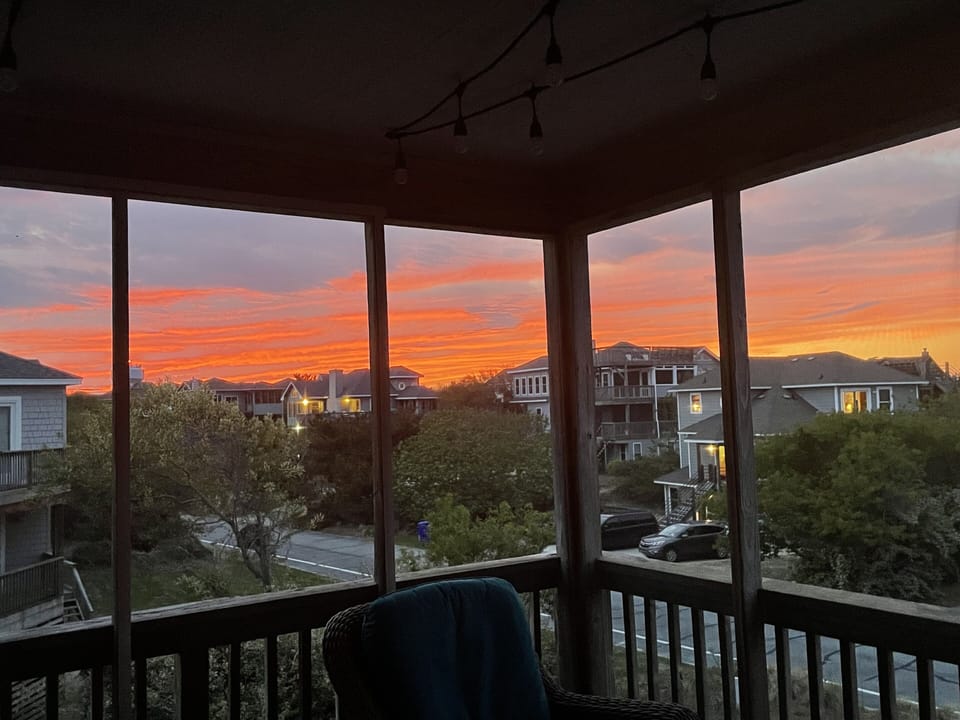 Sunset on the screened porch facing the sound/downtown Duck 