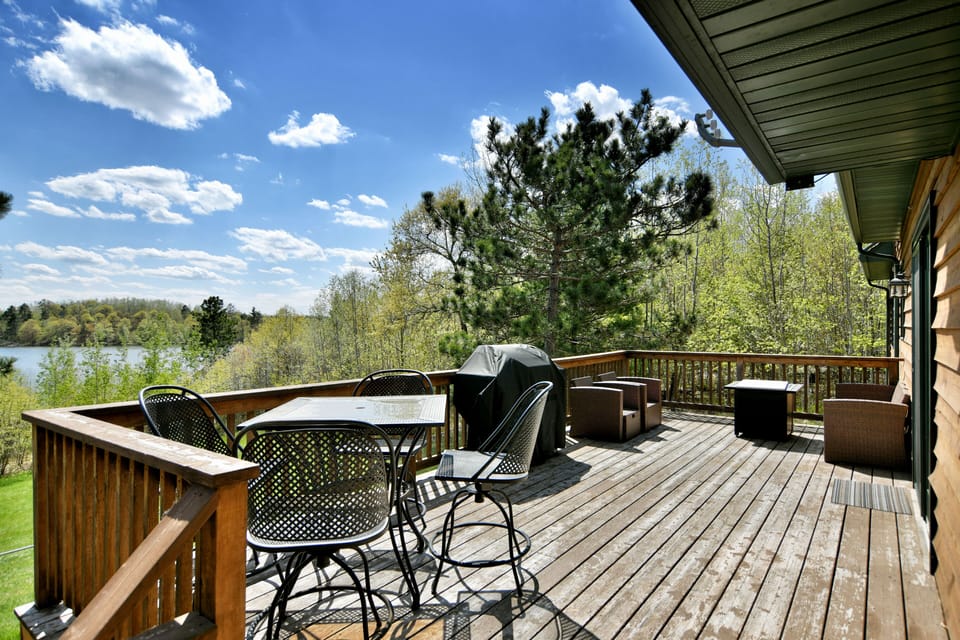 Large Deck overlooking the lake with a gas fireplace!