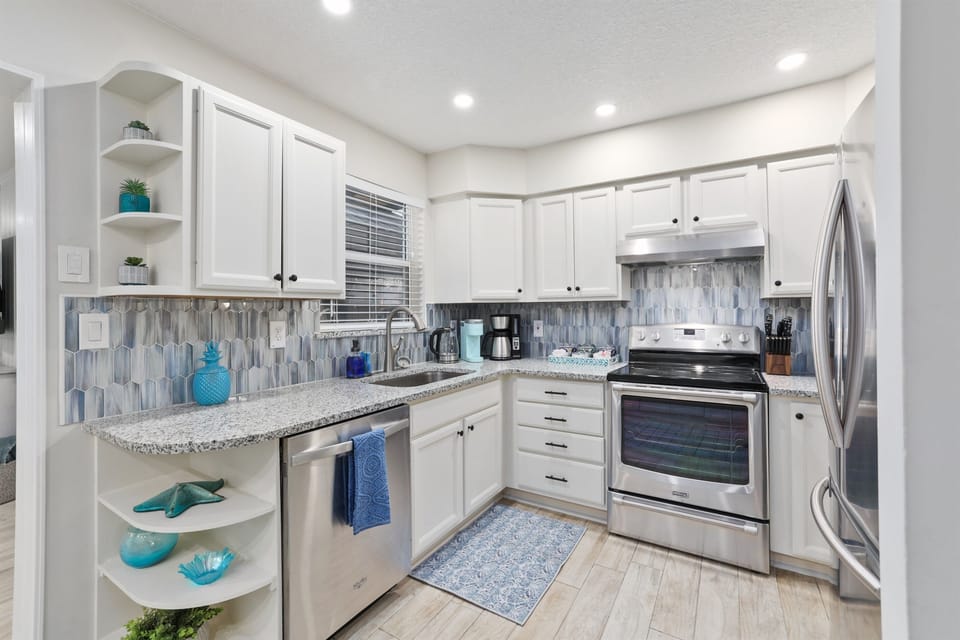 Fully stocked kitchen with modern appliances for efortless cooking