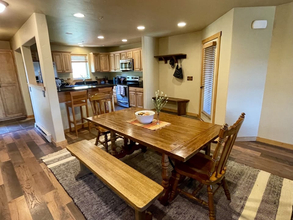 View of fully stocked kitchen from dining table.