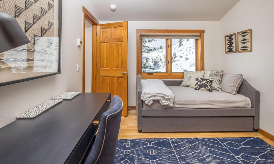 Upstairs Bedroom with Trundle Bed, Desk, and Spacious Closet