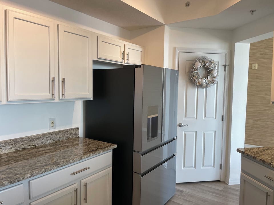 Enjoy the GE Cafe frig and pantry closet with updated shelving and lots of space