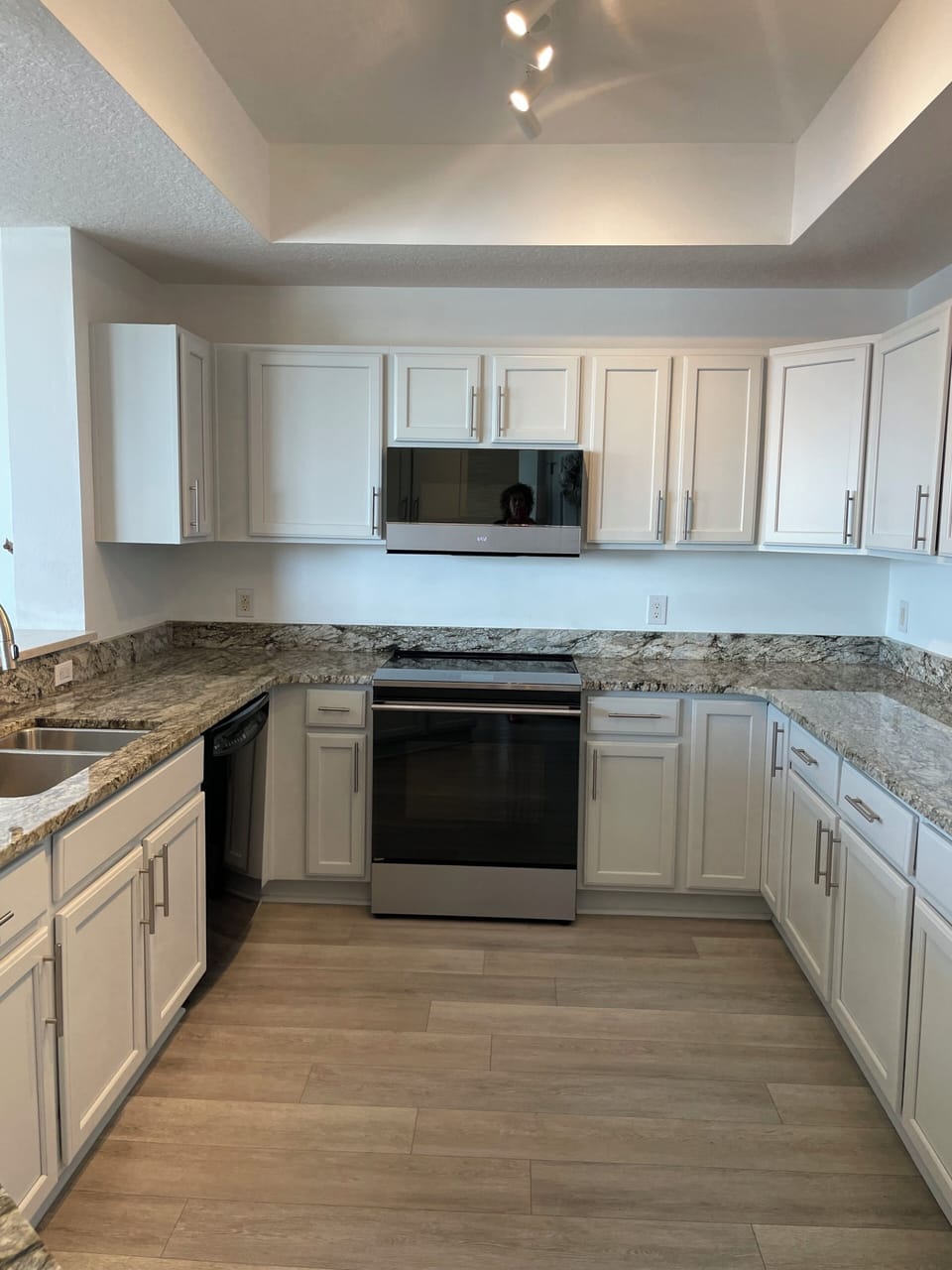 Enjoy the ample counter and cabinet space in this updated kitchen 