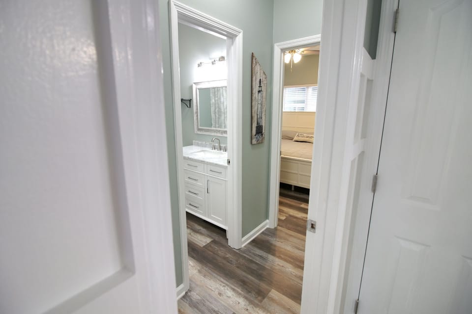 Private hallway to downstairs bedroom and bathroom