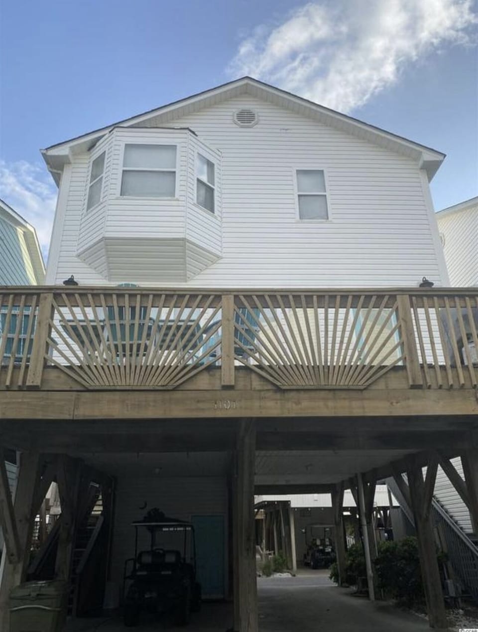 Back of house with parking underneath