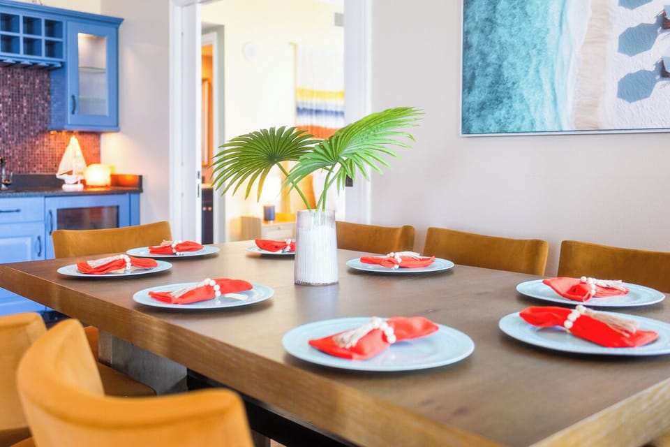 Gather around your elegant dining table, perfectly set for memorable meals with loved ones in your stylish vacation home.