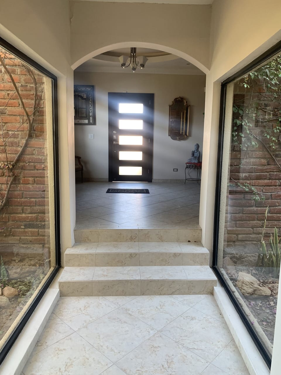 As you leave foyer you pass two beautiful gardens toward open concept kitchen.