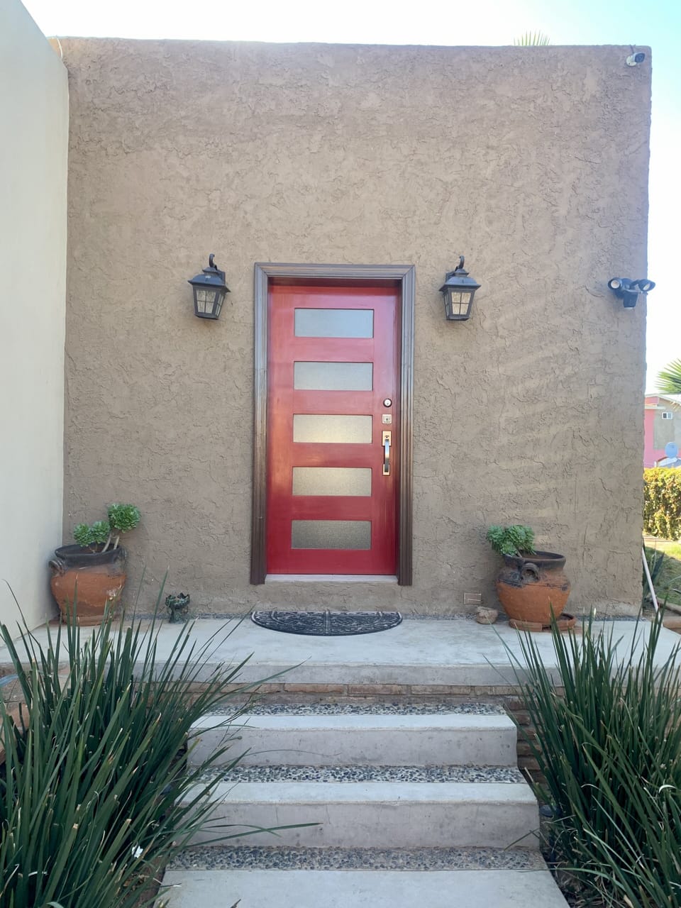 Front Door with well lit pathway.