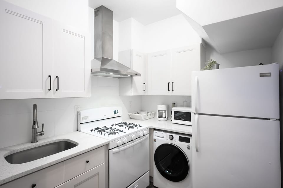 Full Kitchen has a 4-range Gas Stove & Oven, Microwave, and Refrigerator