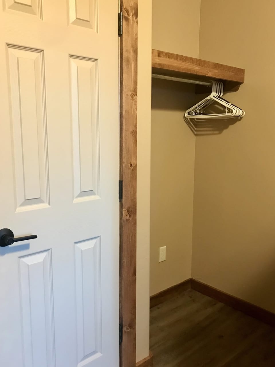 Secondary bedroom clothes hanging and maid's closet.