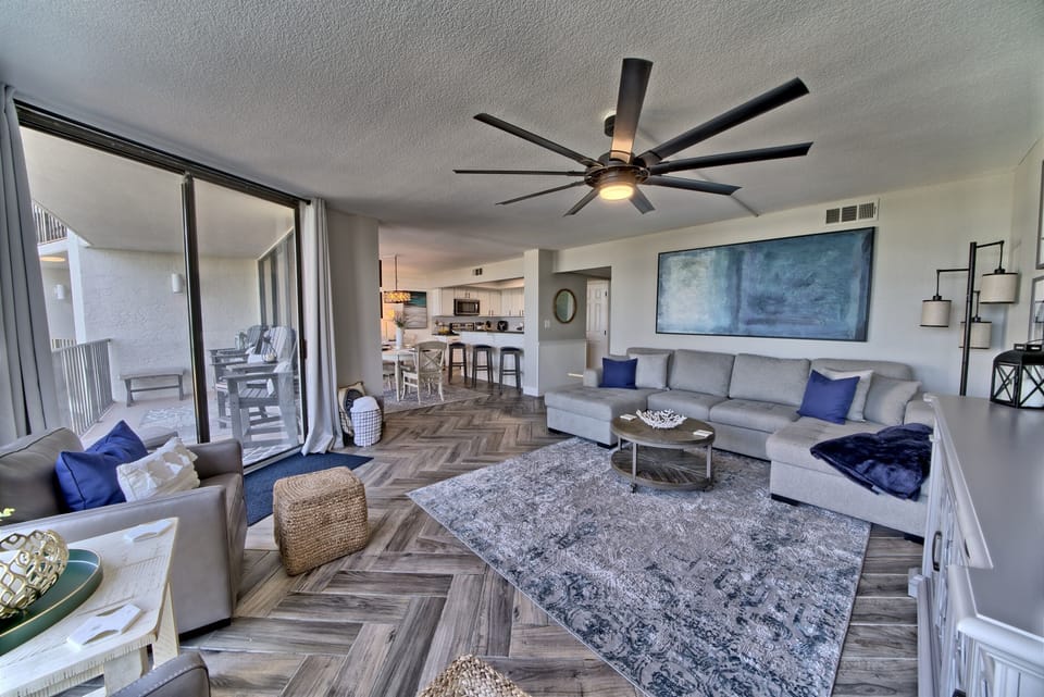 Living room has a new sleeper sofa and swivel chairs to enjoy the amazing view of the pool and the Gulf of Mexico