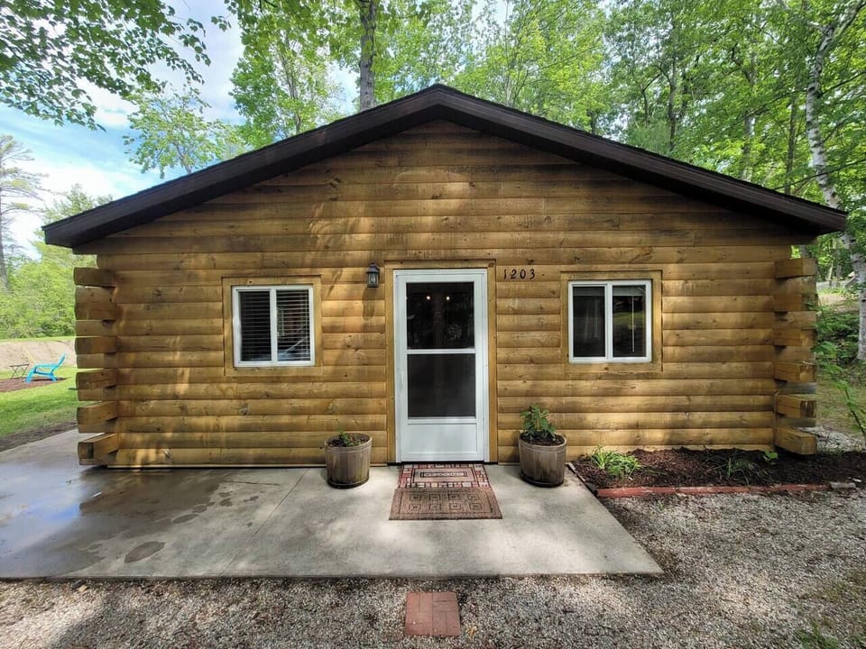 Side view of the cabin with entry door from the driveway.