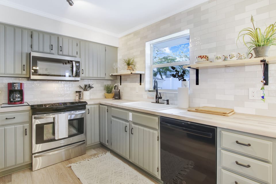 Airy, bright & fun, this kitchen just makes you happy. Fully stocked!