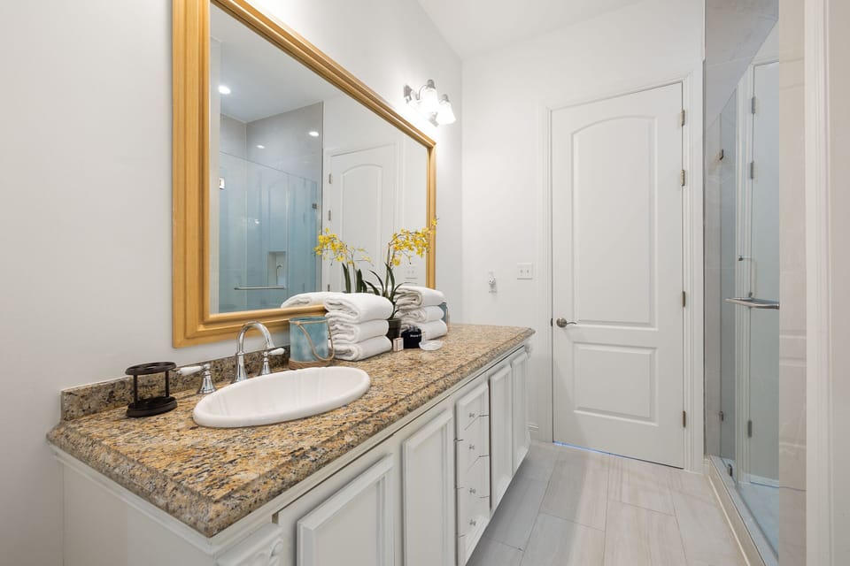 Private bathroom with a walk in shower attached to the second floor bunk room.