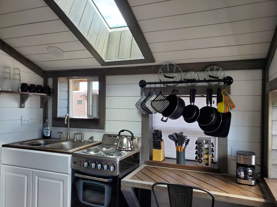 Kitchen: View of Pikes Peak in window above the sink, skylight, small oven.