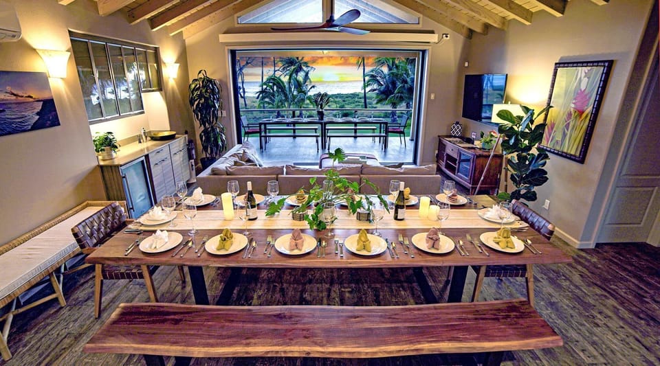 Seating for 14 at dining table, plus 3 at breakfast bar. Also 14 seats on deck dining table and an side area for 4 more on the deck.