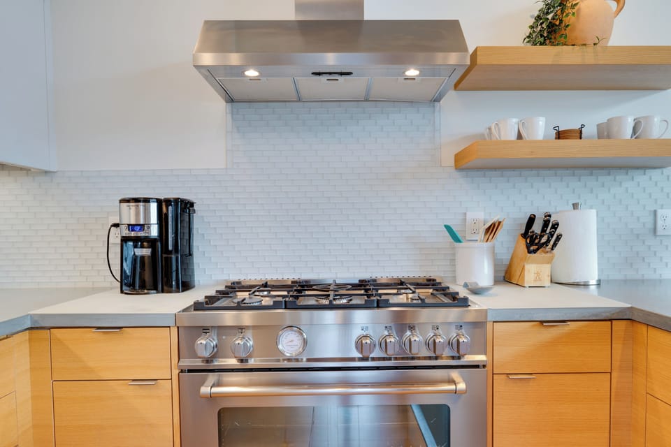 6-burner gas stove, Keurig machine, convection oven, and basic cooking items.