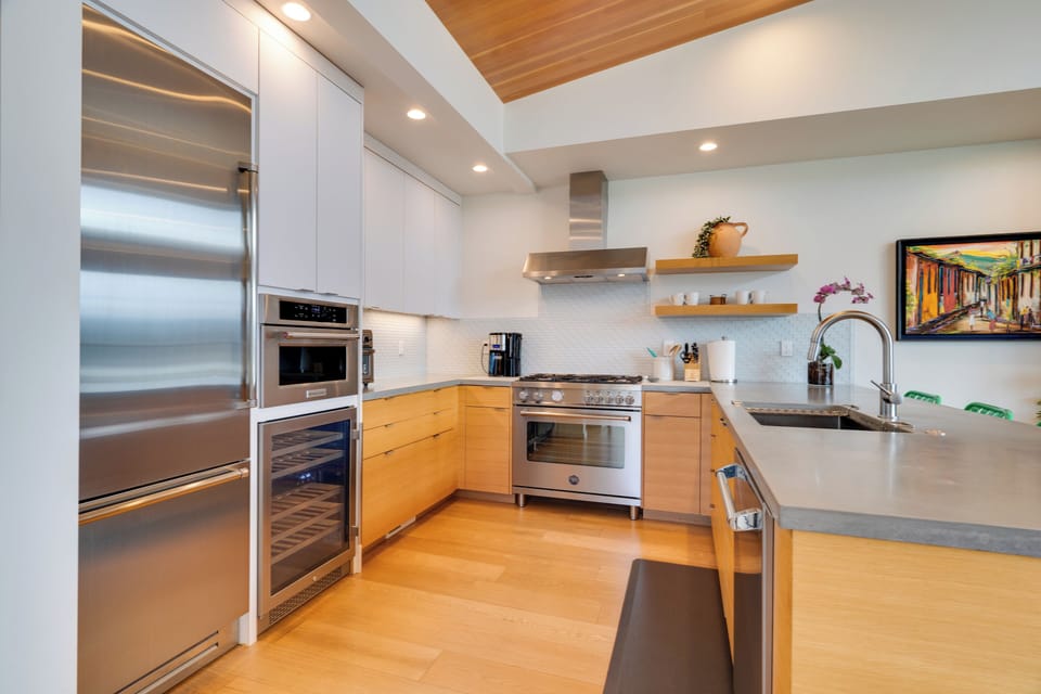 Built-in refrigerator, microwave, wine fridge, toaster oven, and stove