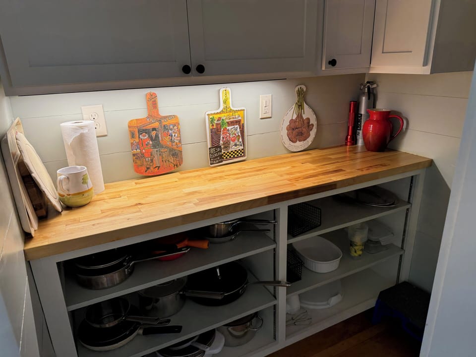 Pantry with all the necessities for cooking and serving.
