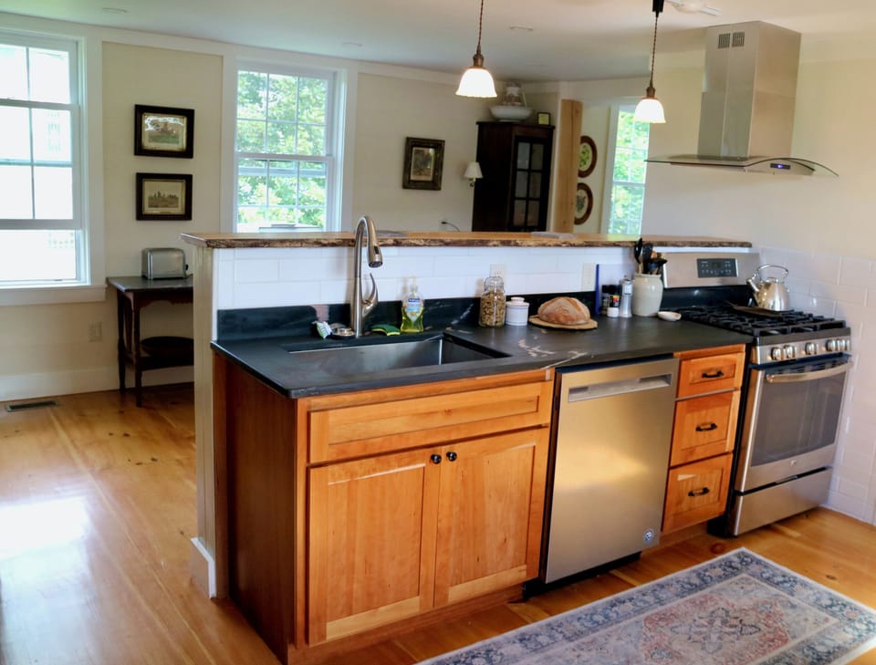 Modern kitchen with everything a chef needs. Loving the soapstone counters!