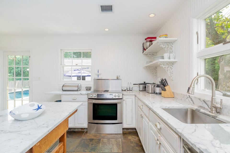 Fully Equipped Kitchen With Door To BBQ Area / Deck And Pool