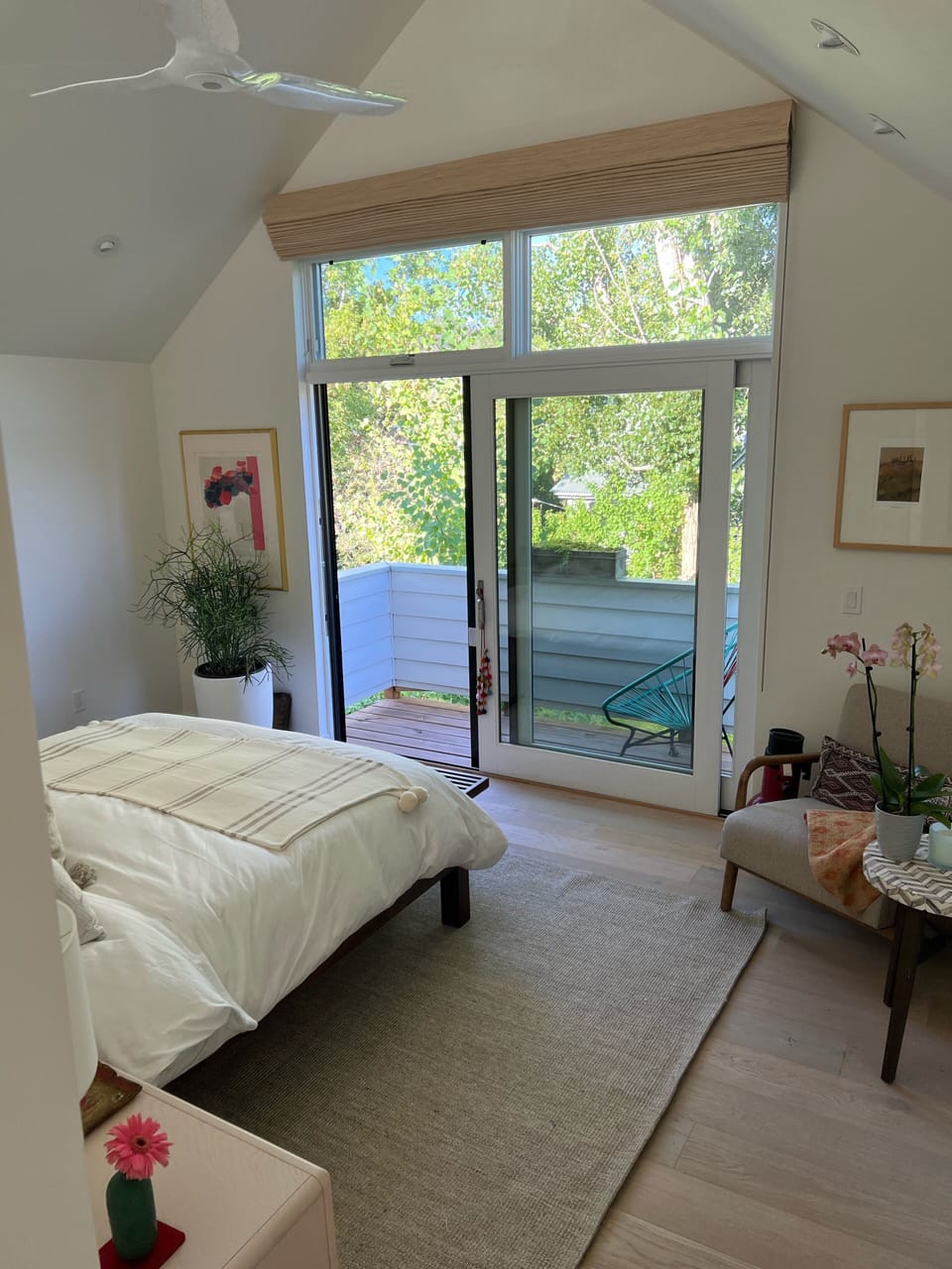 Master bedroom with private deck and views of Colorado mountains.