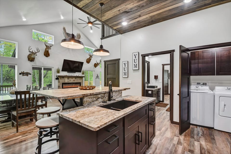 Kitchen w/ laundry closet.