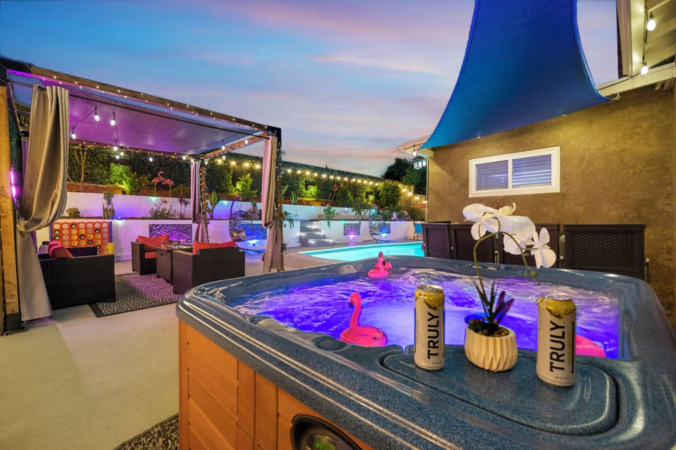 The backyard glows with custom ambient lighting at night