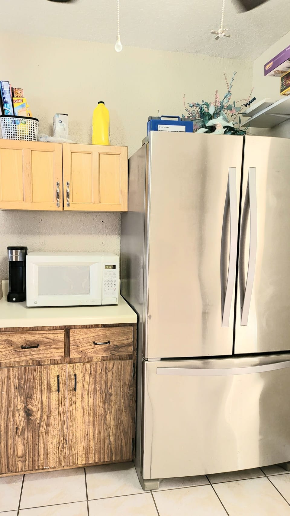 kitchen with full refrigerator and microwave 