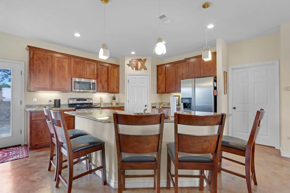 Bar seating for four is perfect for visiting with the cook.