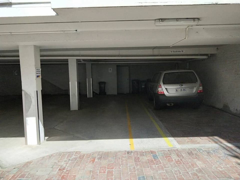 Secure off-street parking for two vehicles (one behind the other) is available underneath the townhouse. Please check the maximum vehicle height of 1.8 metres to ensure a perfect fit for your vehicles.