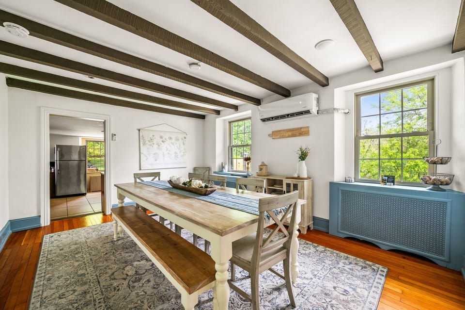 The 8-person dining table includes a bench and 5 chairs.