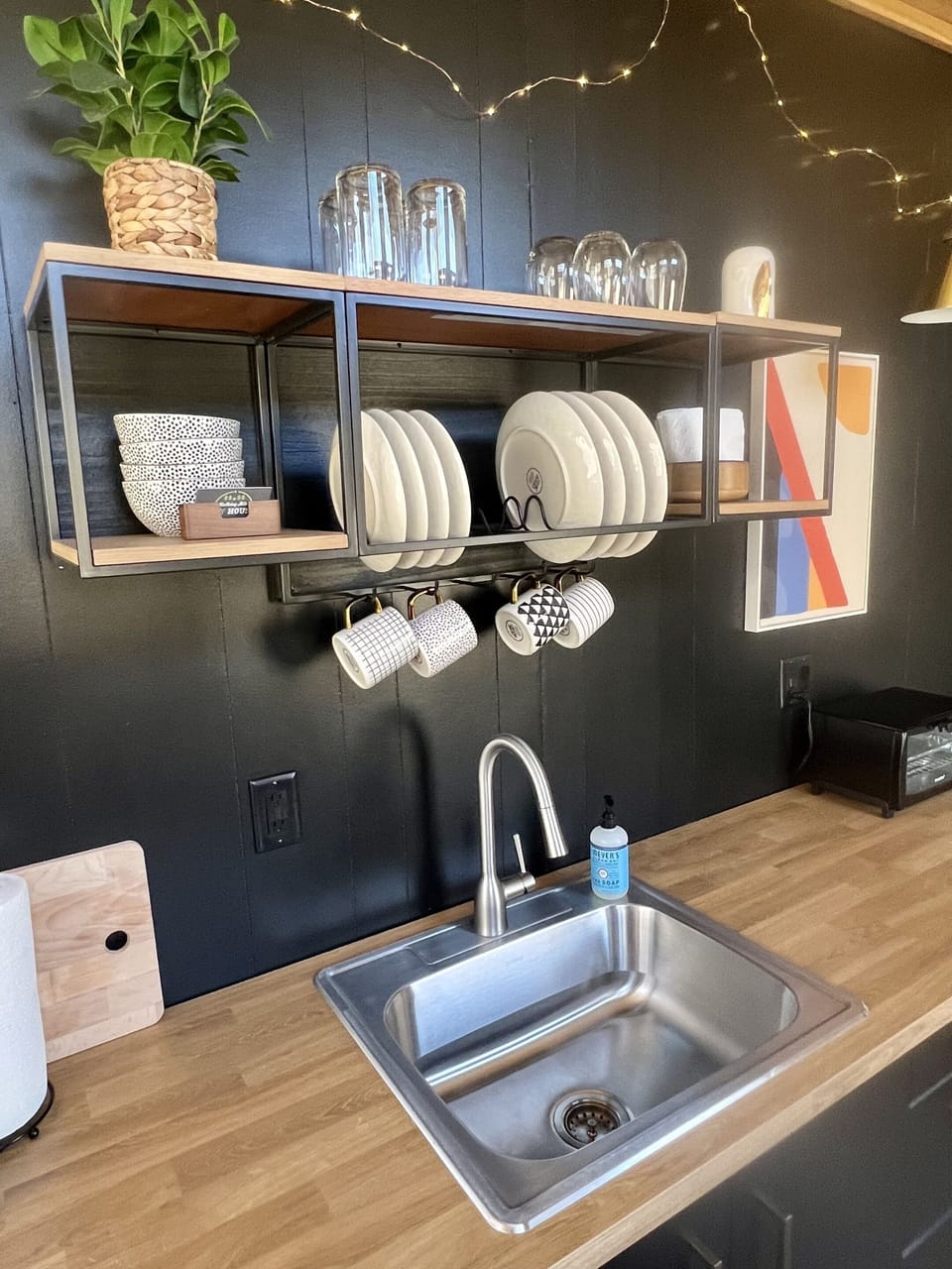 The kitchen also includes cups, plates, and glasses as shown in the picture, as well as silverware, pots and pans, and all else you need to prepare and serve your meals.  