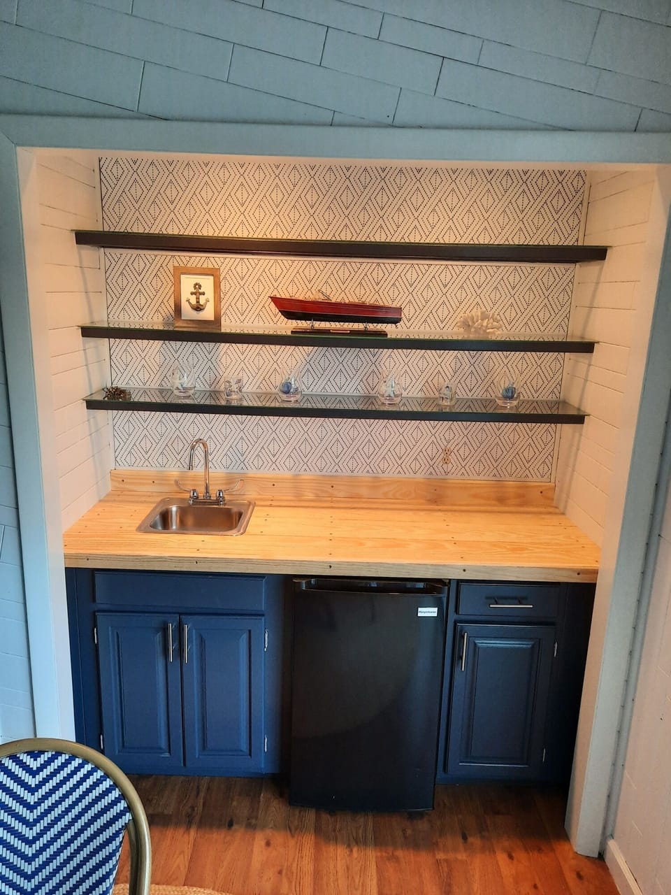 Wet bar with mini fridge, perfect for entertaining.

