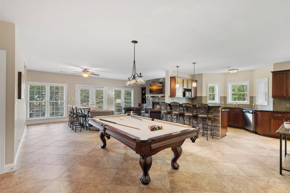 Lower Level Game room with kitchen, bar, pool table & family room.