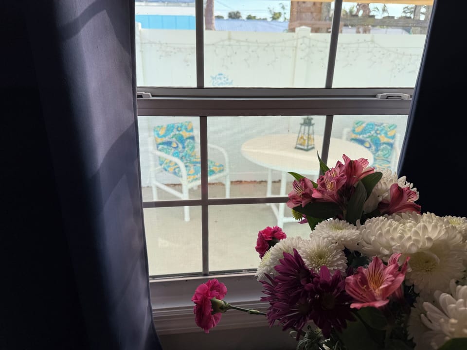 Fresh flowers and a view of the back patio