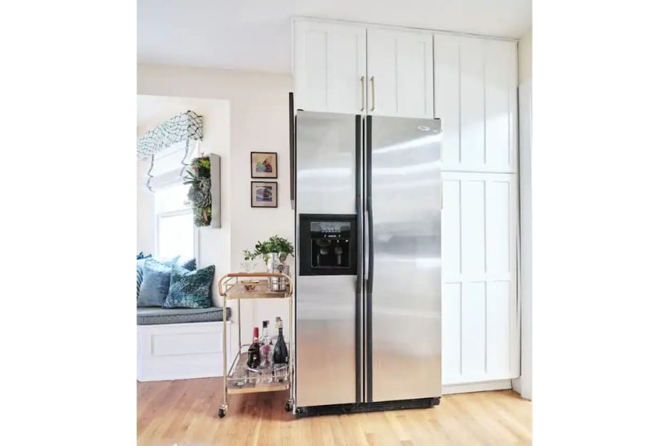 New refrigerator coming. Bar cart and bfast nook to left; pantry on right.