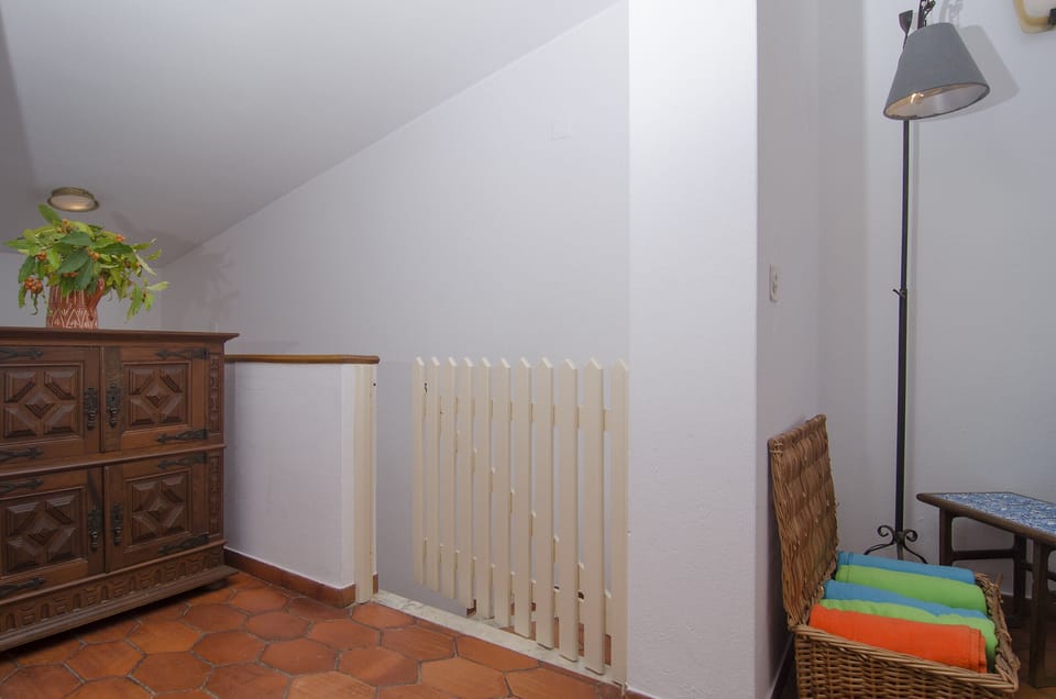 Stairs to the lower floor with grating for security
