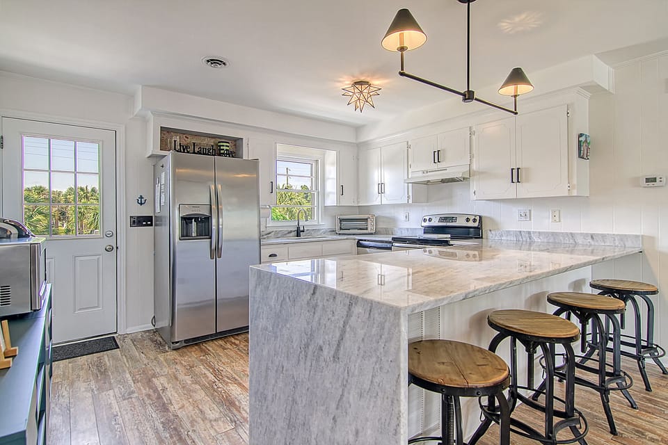 View is Kitchen from dining to show large Island with seating 