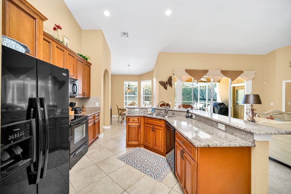 Fully equipped kitchen with modern appliances.
