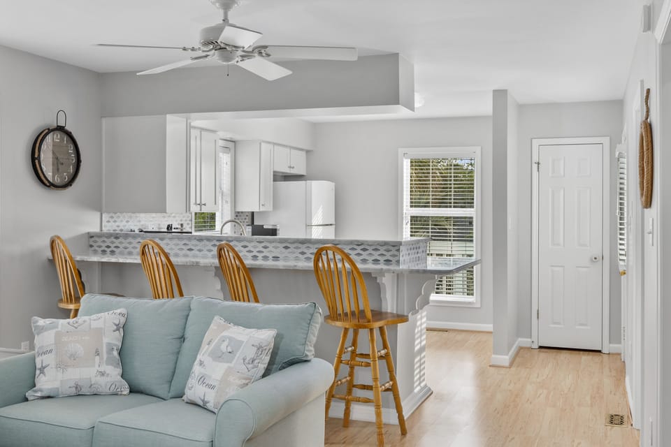 A view of the East Living Room into the East Kitchen