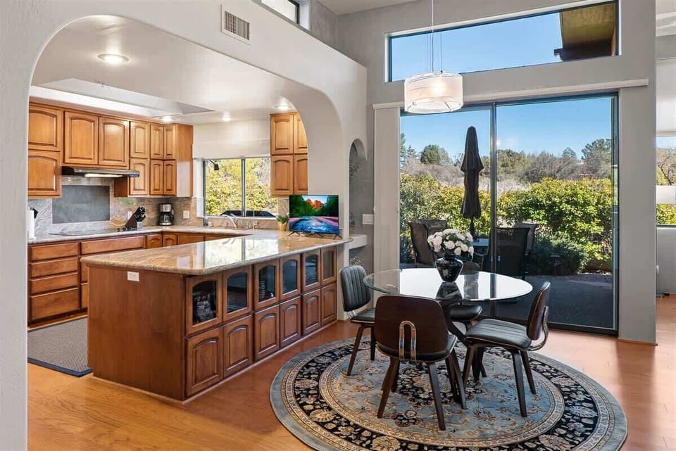 There is a smaller dining table adjoining the kitchen