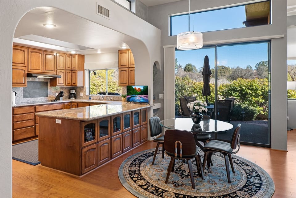 There is a smaller dining table adjoining the kitchen