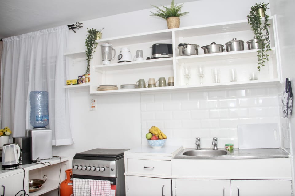 Fully Fitted Kitchen with appliances, cooker, microwave, fridge, water dispenser