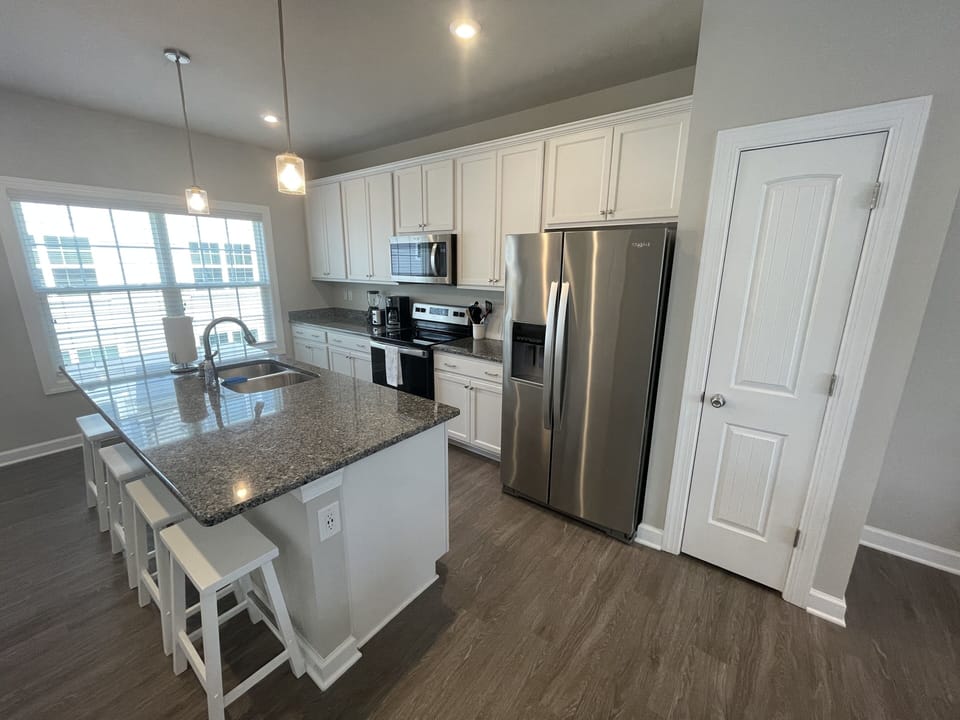 Large kitchen with bar for additional seating