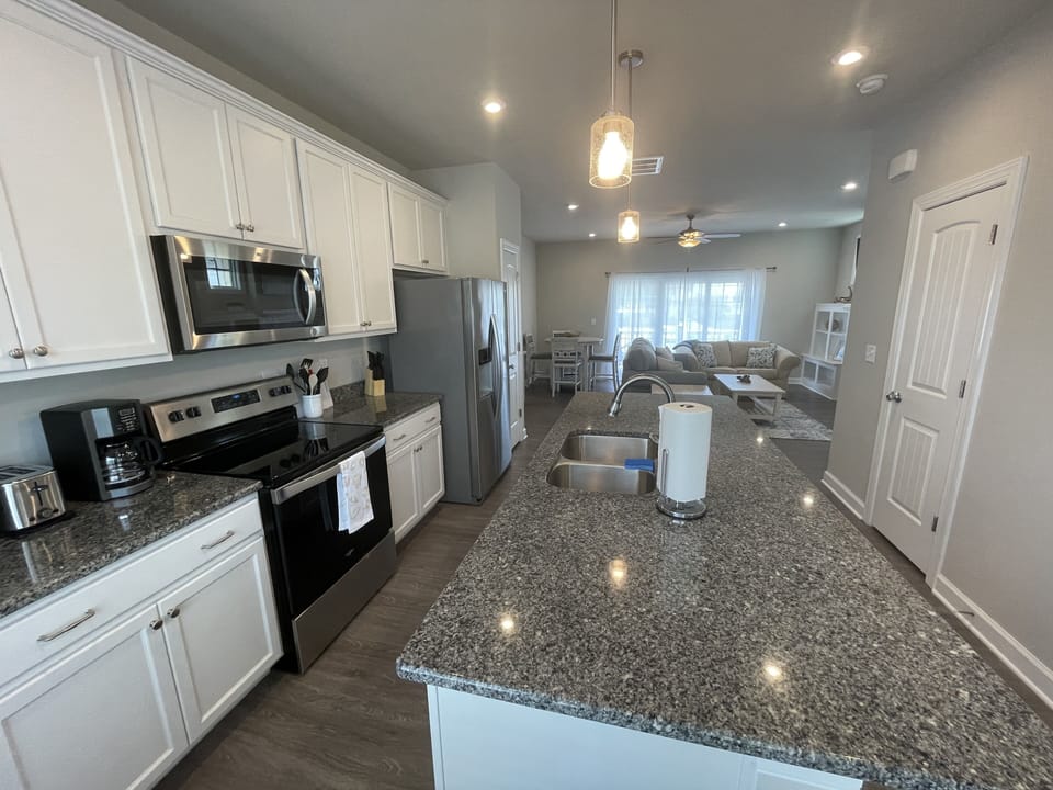 Large kitchen with bar for additional seating