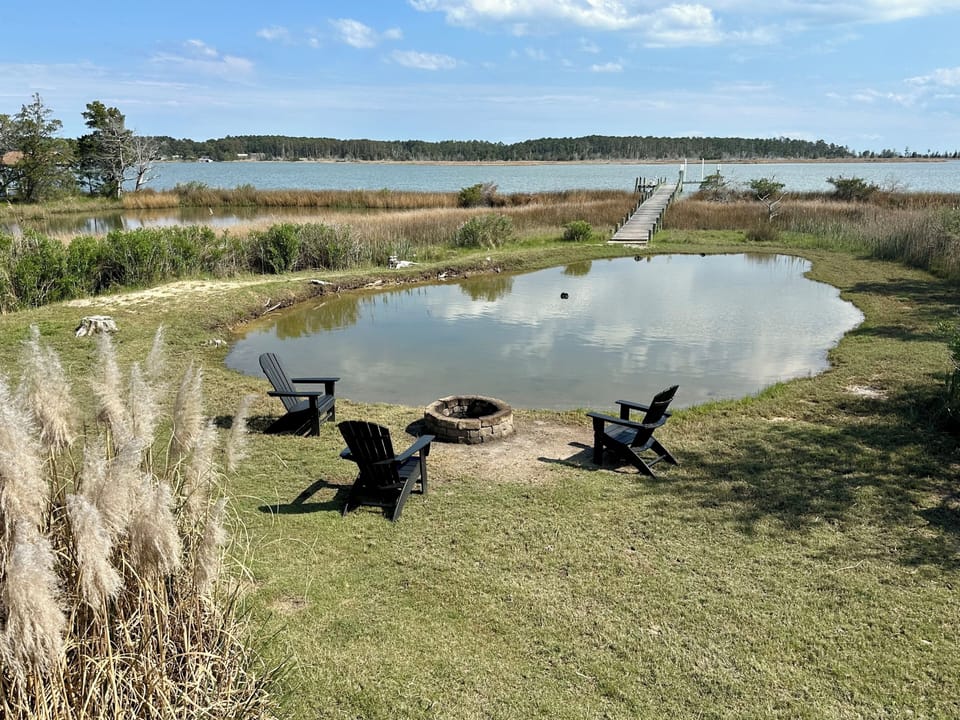 Firepit next to tidal pond with views of the Harbor