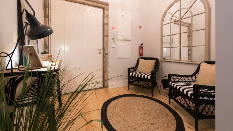 A chic entrance area welcomes you with comfortable seating and a statement mirror, setting the tone for your stay.
#EntranceHall #StylishWelcome #LovelyStay