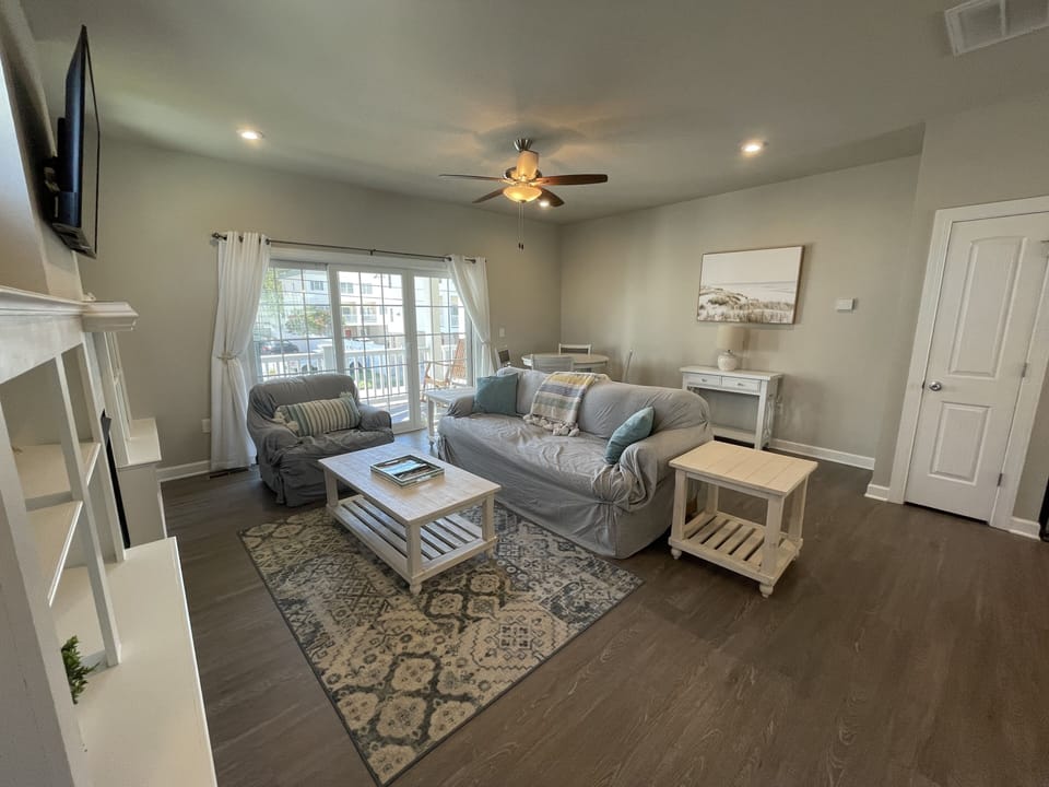 Living room with access to 2nd story deck