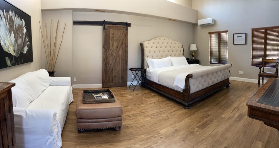Sleep among soft whit-washed linens on a king-size bed 